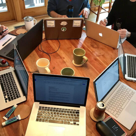 teamwork laptops in a circle